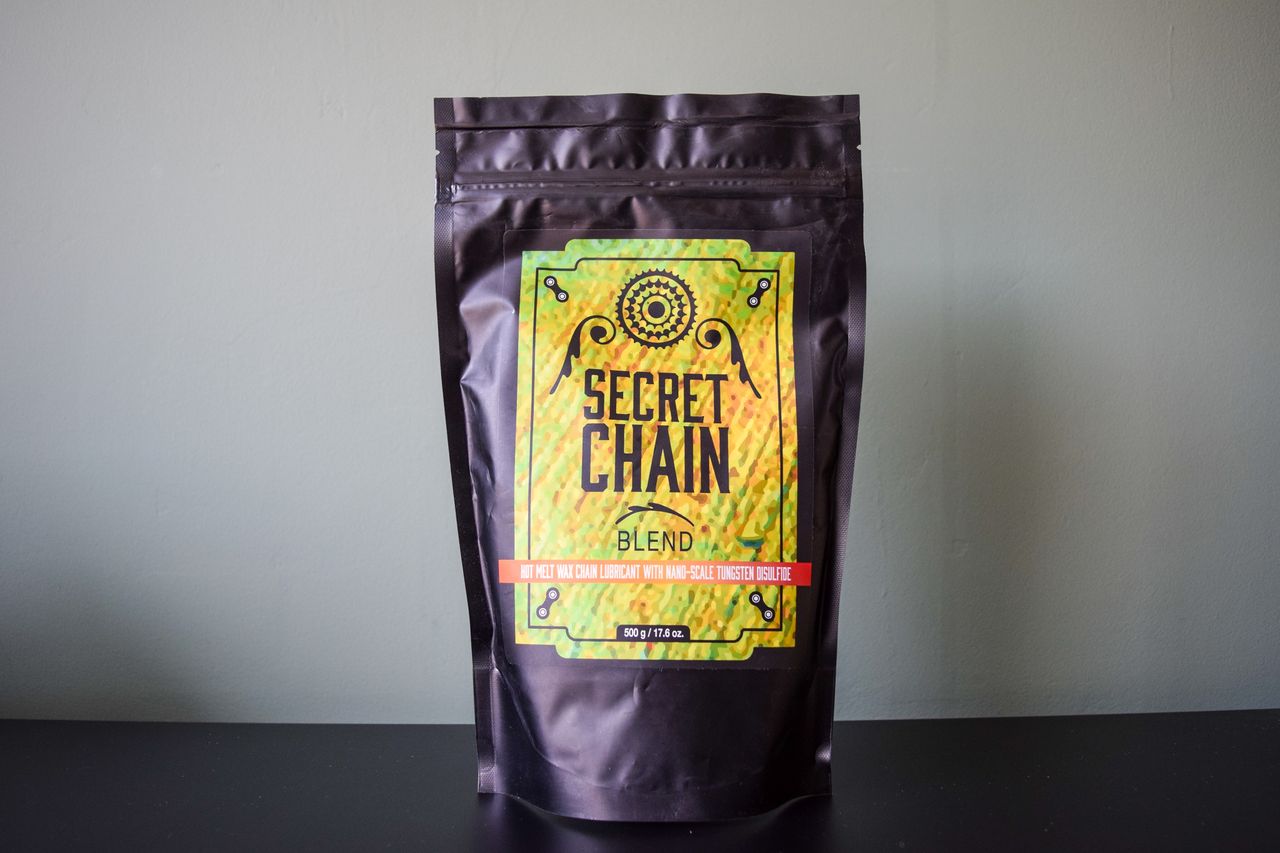 A bag of Silca Super Secret chain wax on a metal worktop