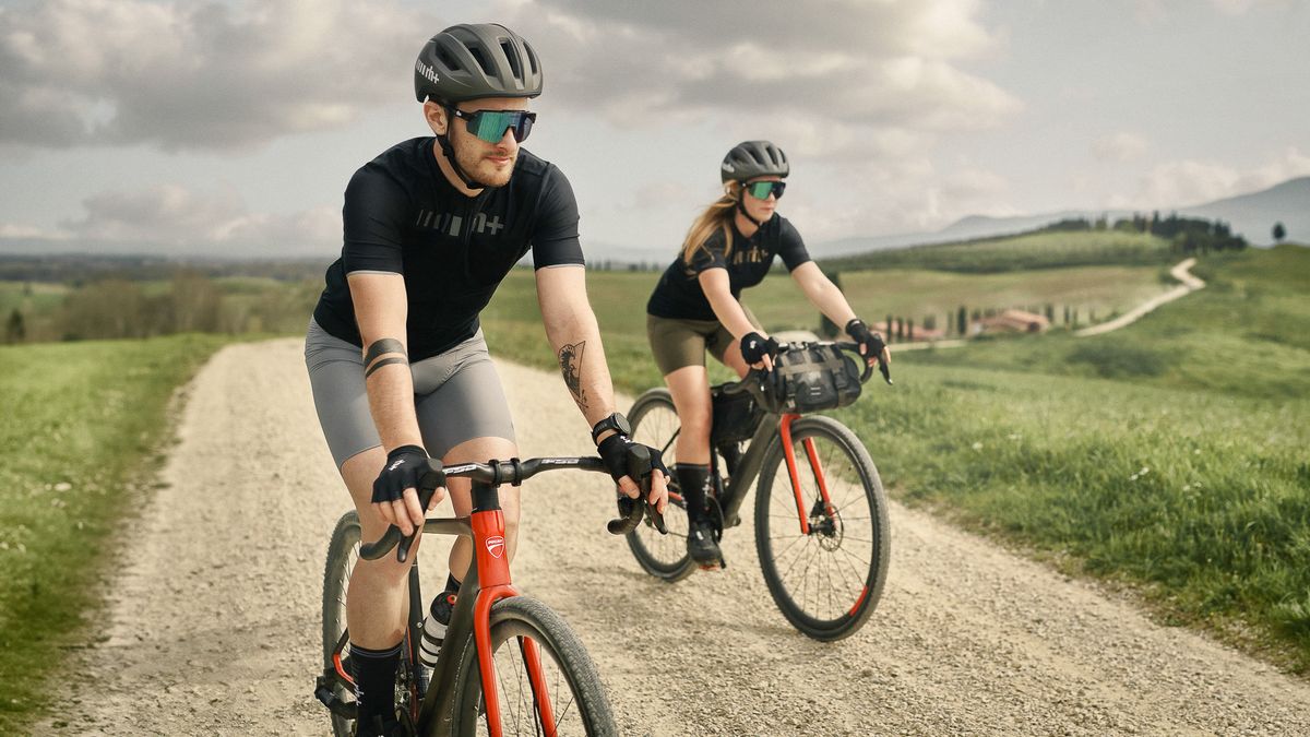 Riders on e-gravel bikes on a long trail