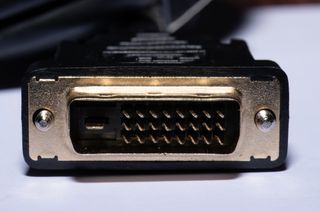 A close up of a black and silver DVI cable