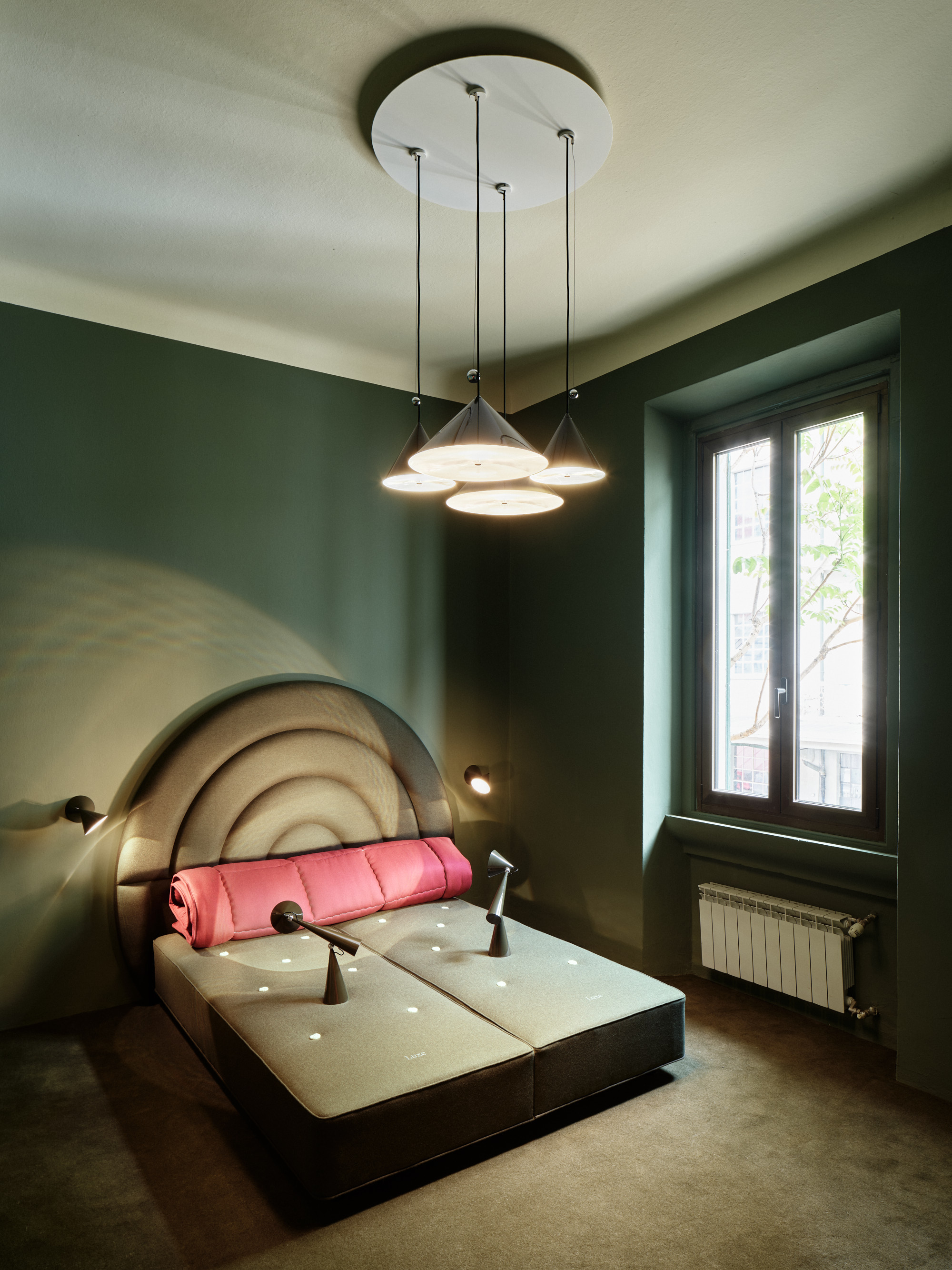 Inside Mua Mua Hotel designed by Tom Dixon for Milan Design Week 2026, featuring Tom Dixon x Vispring bed collaboration