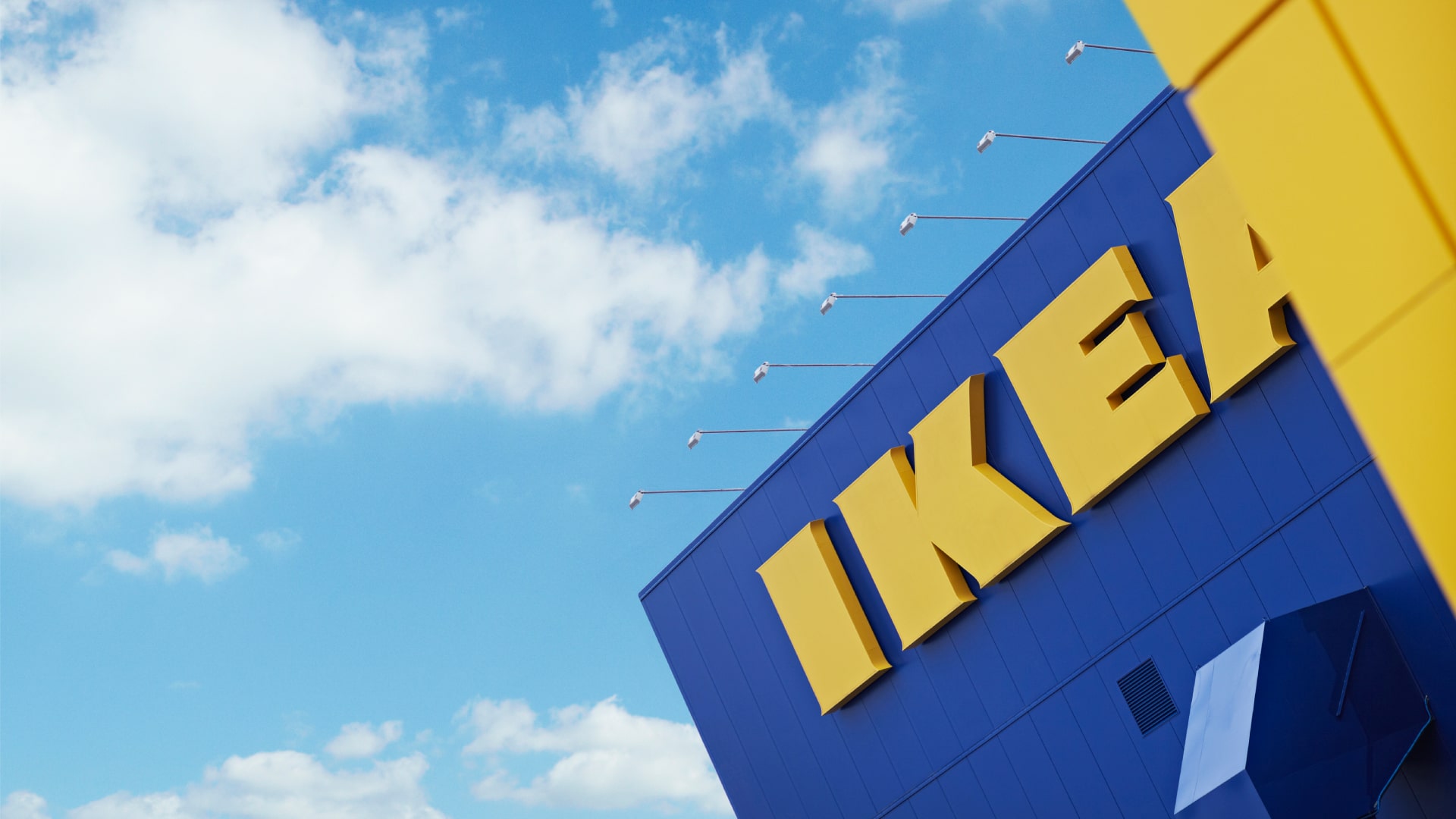 An IKEA store against a blue sky.