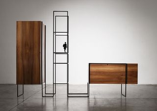 'Tecla' wardrobes composed of walnut wood and framed in black-varnished iron