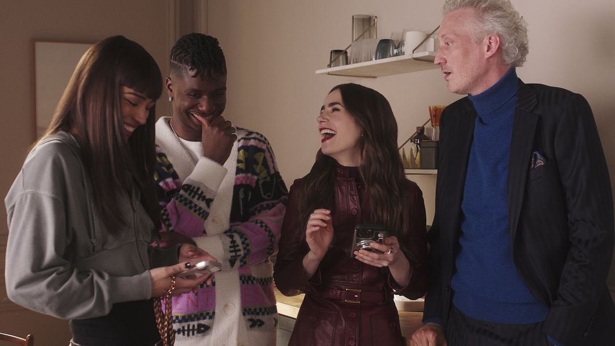 Thalia Besson as Genevieve, Samuel Arnold as Julien, Lily Collins as Emily, Bruno Gouery as Luc in episode 407 of Emily in Paris