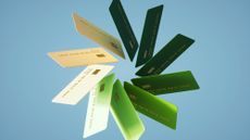 Illustrated image of multicolored credit cards organized into a circular pattern against a blue background