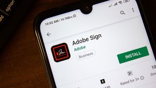 A phone with the Adobe Sign app installed
