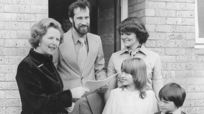 Margaret Thatcher photographed in 1979 handing over the deeds to a council house to the King family in Milton Keynes