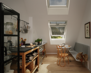 Velux external anti-heat blinds in loft kitchen with bench seating