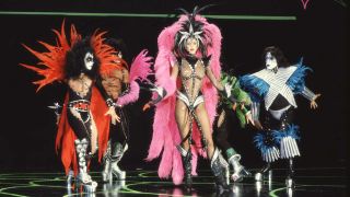 Lynda Carter with dancers dressed as Kiss