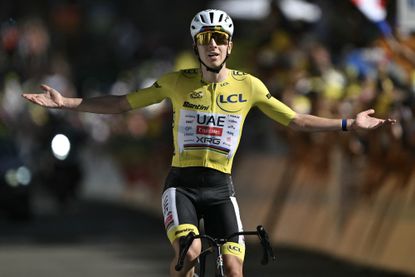UAE Team Emirates - XRG's Slovenian rider Tadej Pogacar wearing the overall leader's yellow jersey cycles to the finish line to win the 19th stage of the 113th edition of the Tour de France cycling race, 127,9 km between Gap and Alpe d'Huez in the French Alps, on July 24, 2026. (Photo by Jeff PACHOUD / AFP)
