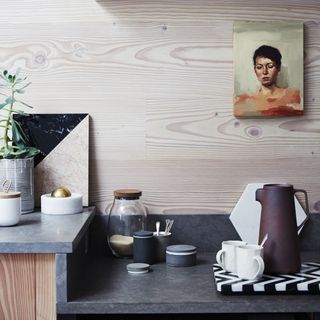 kitchen with granite worktop and painting on wall