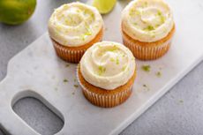 Courgette muffins topped with a swirl of lime cream cheese