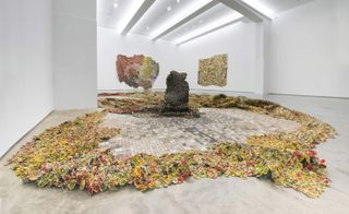 Anatsui's 2012 'Tiled Flower Garden', which snakes 30 feet across the gallery floor.
