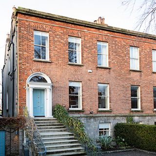 terraced house with steps to front door