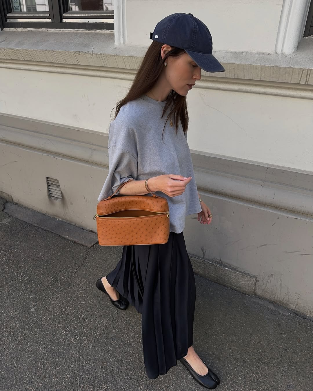 Annabel Rosendahl wearing a tan bag
