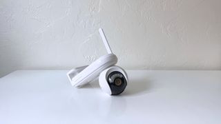 The Reolink Altas PT Ultra smart home camera on a white table