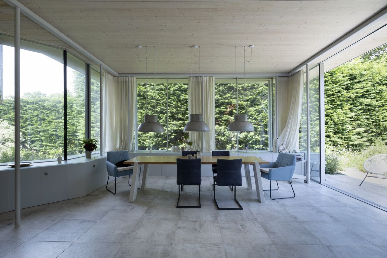 light filled dining room with lots of windows