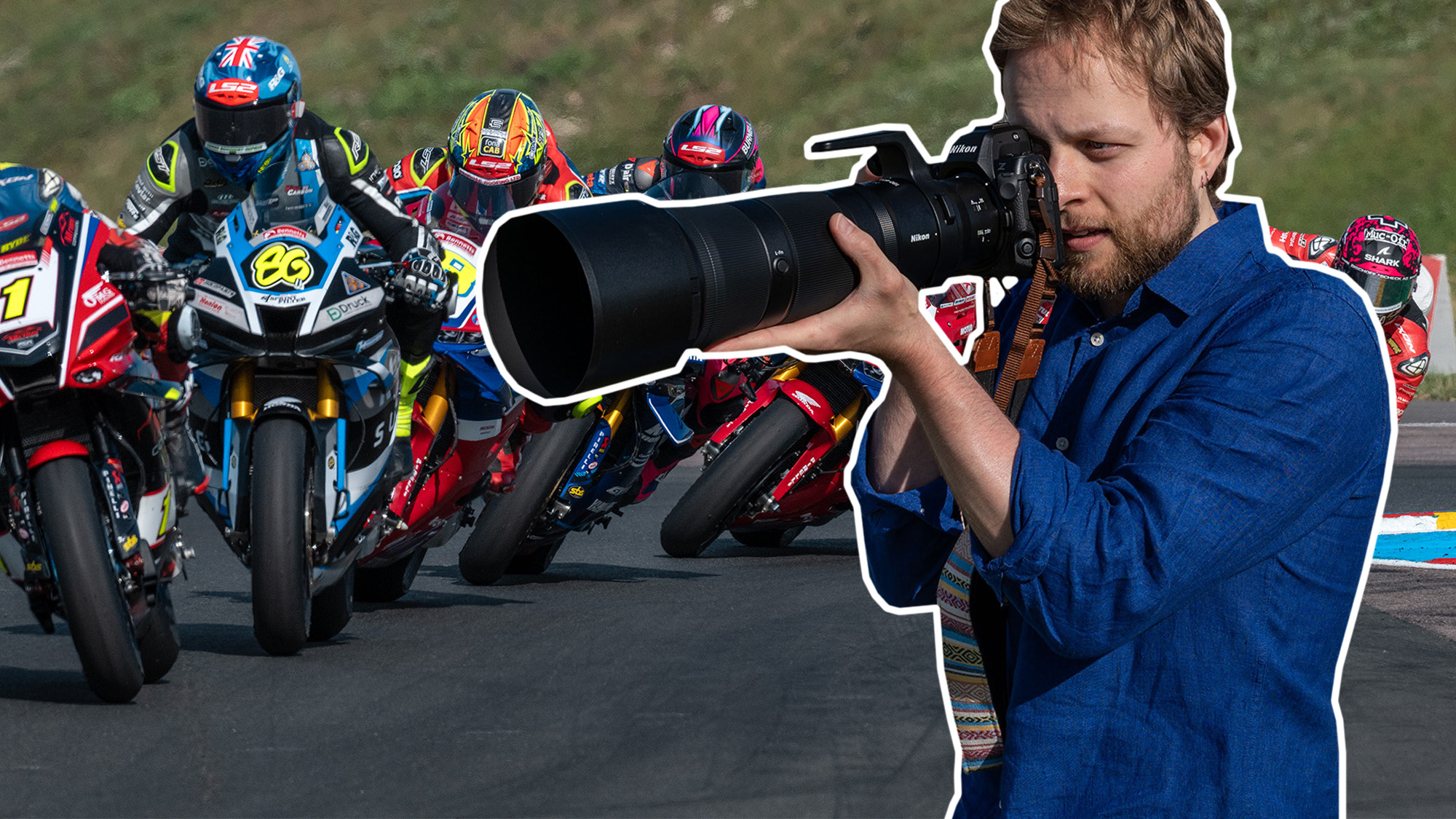 Mike Harris holding Nikon Z 180-600mm in front of superbike race 