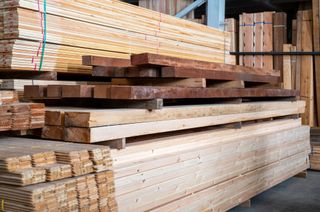 A pile of wooden planks in a timber yard