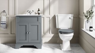 traditional close couple toilet and grey painted vanity unit