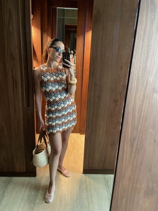 senior editor Anna LaPlaca wearing a crochet All That Remains dress and Prada oval sunglasses at the St. Regis Kanai Riviera Maya