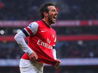 Santi Cazorla of Arsenal celebrates scoring to make it 2-1 during the Barclays Premier League match between Arsenal and Aston Villa at the Emirates Stadium on February 23, 2013 in London, England.