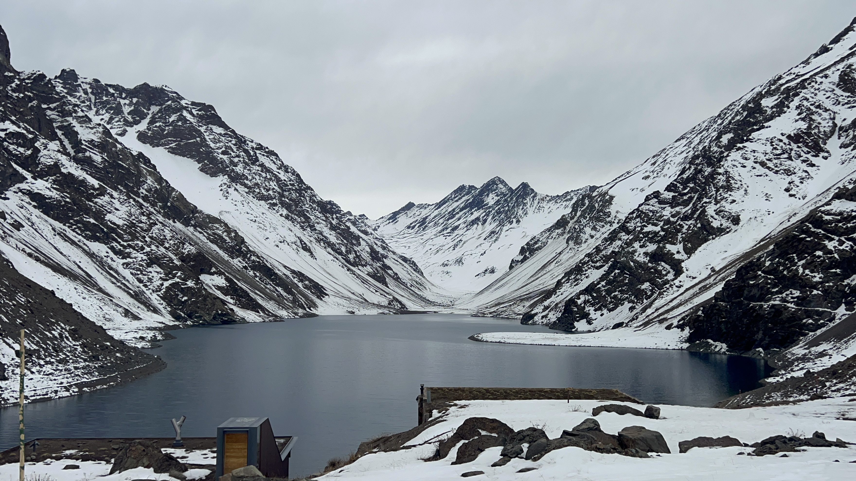 Lake Inca next to the snow-covered peaks of the Portillo Ski Resort in Chile