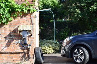 ev car charging at home in a rural setting