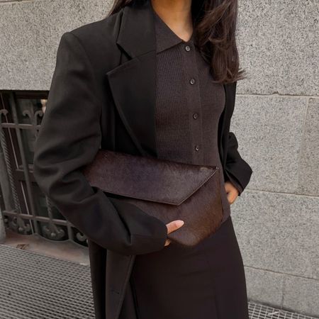@ingridedvinsen wearing a brown wool coat, collared cardigan, pencil skirt, low heels, and pony hair clutch 