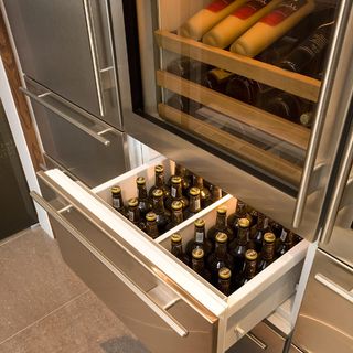 refrigeration area with fridge freezer and wine coolers