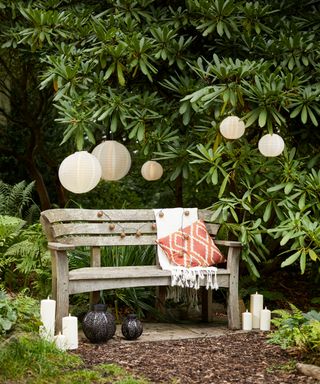 wooden bench with lanterns and LED candles