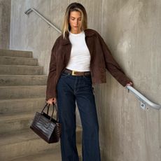 Cass Dimicco in jeans and a suede jacket