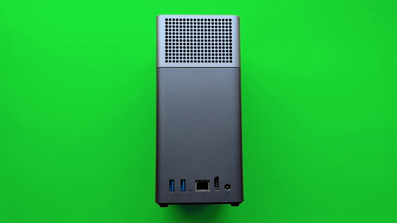 UGREEN NASync DH2300 on a green card paper background