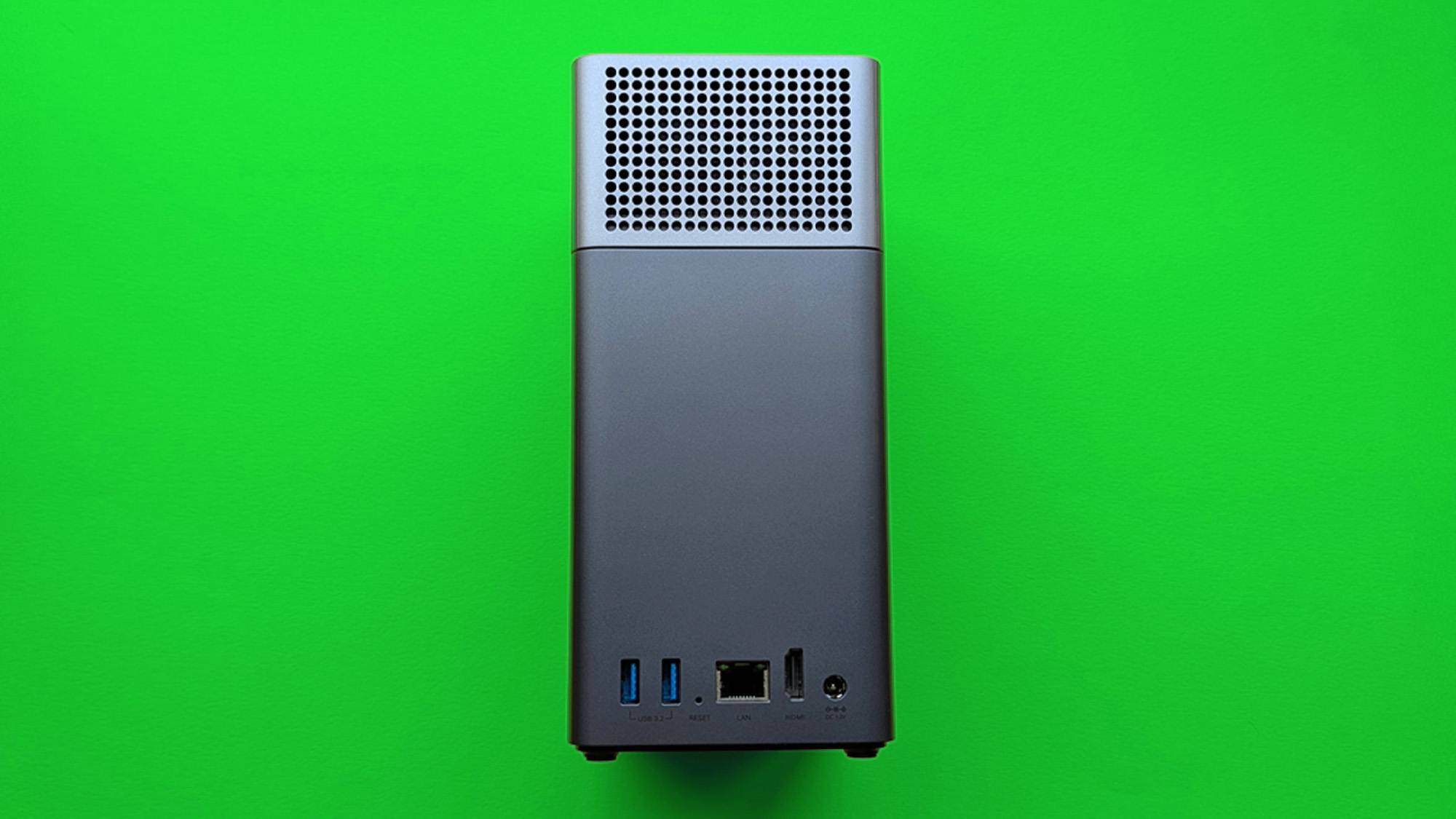 UGREEN NASync DH2300 on a green card paper background