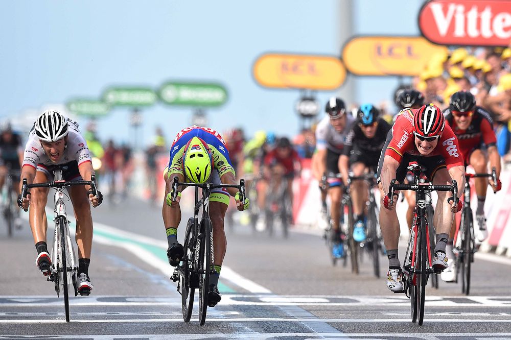 Andre Greipel wins stage 2 of the 2015 Tour de France by a bike throw over Peter Sagan.
