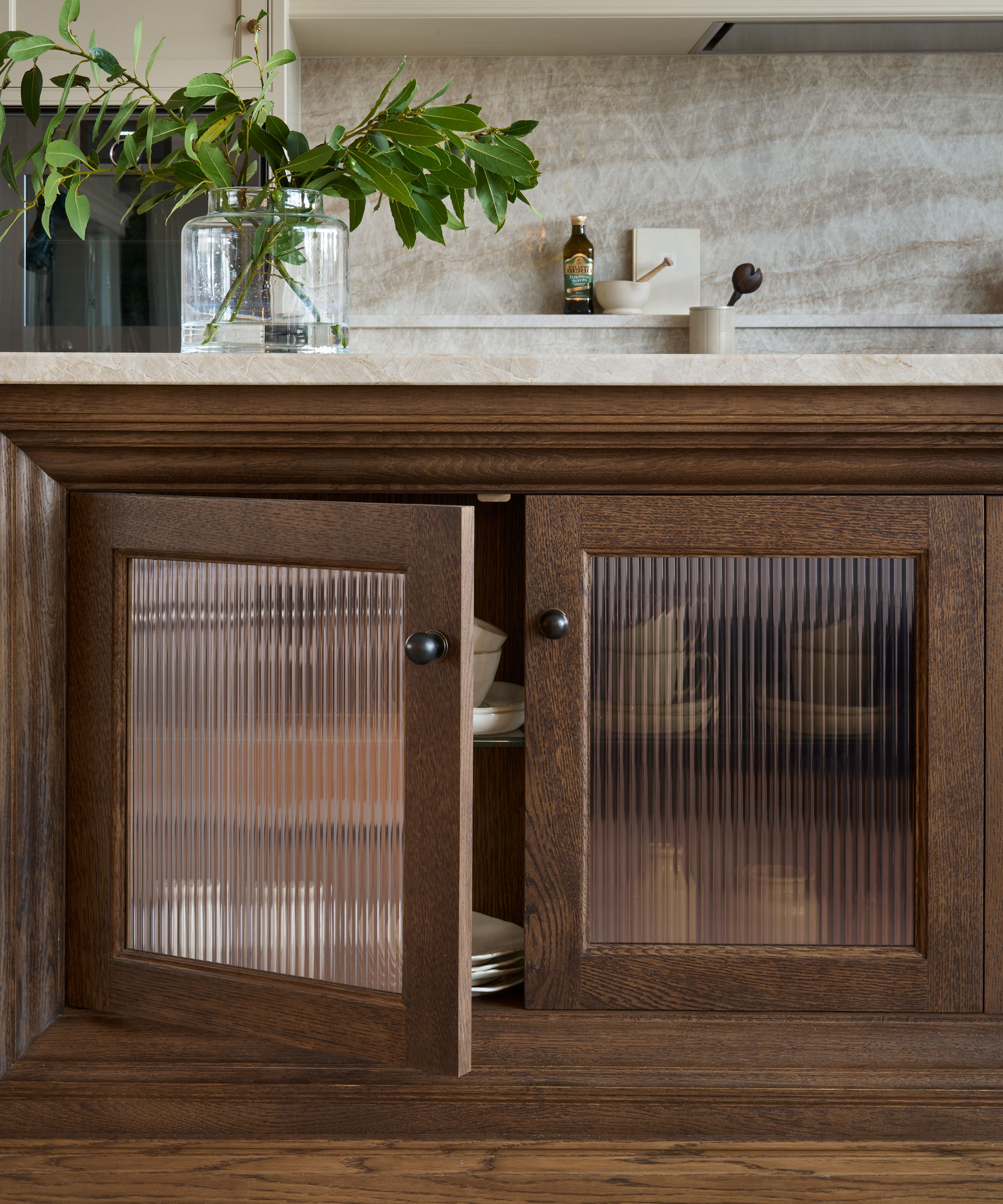 wooden kitchen units with fluted glass doors