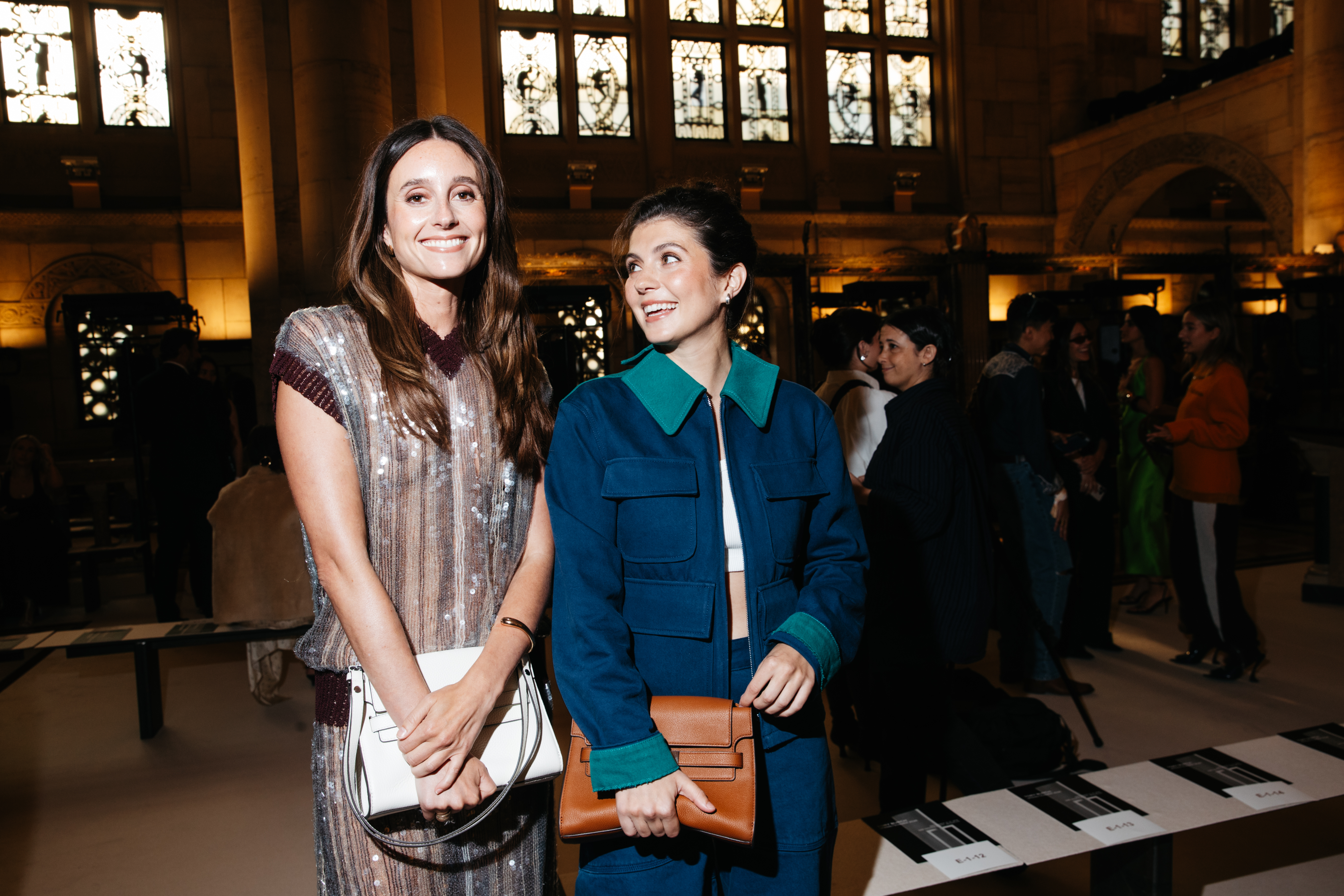 Emily Bader and Mary Beth Barone carrying Tory Burch bags