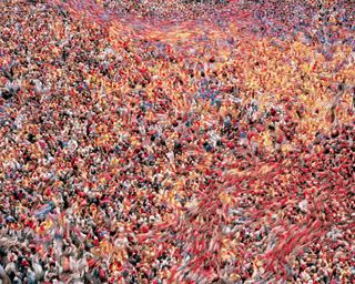 Crowd of people with colours swirling together