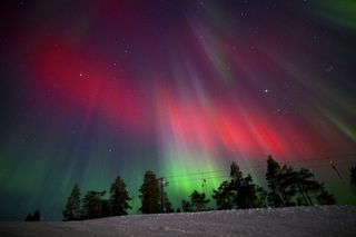 The Aurora Borealis over ski slope in Levi, Lapland, in the new year on January 01, 2025