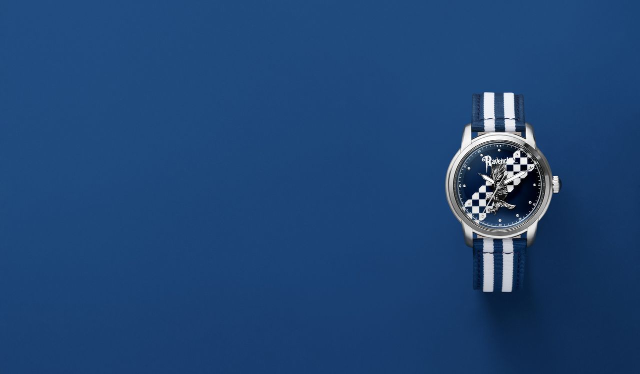 A Harry Potter x Fossil Nylon watch in the Ravenclaw design, on a blue background
