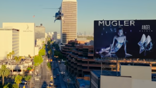 Mugler billboard in Coi Leray music video