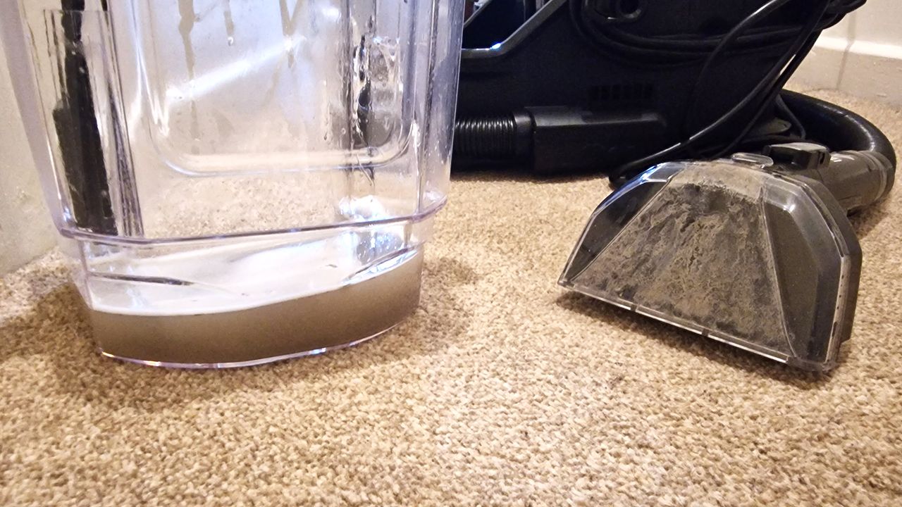 Bissell SpotClean HydroSteam being used on carpet