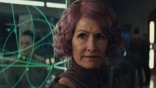 Laura Dern's Amilyn Holdo standing in front of Resistance display