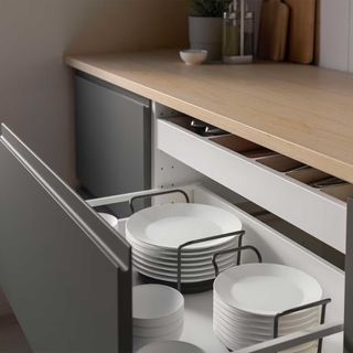 Grey kitchen drawer with plate holders