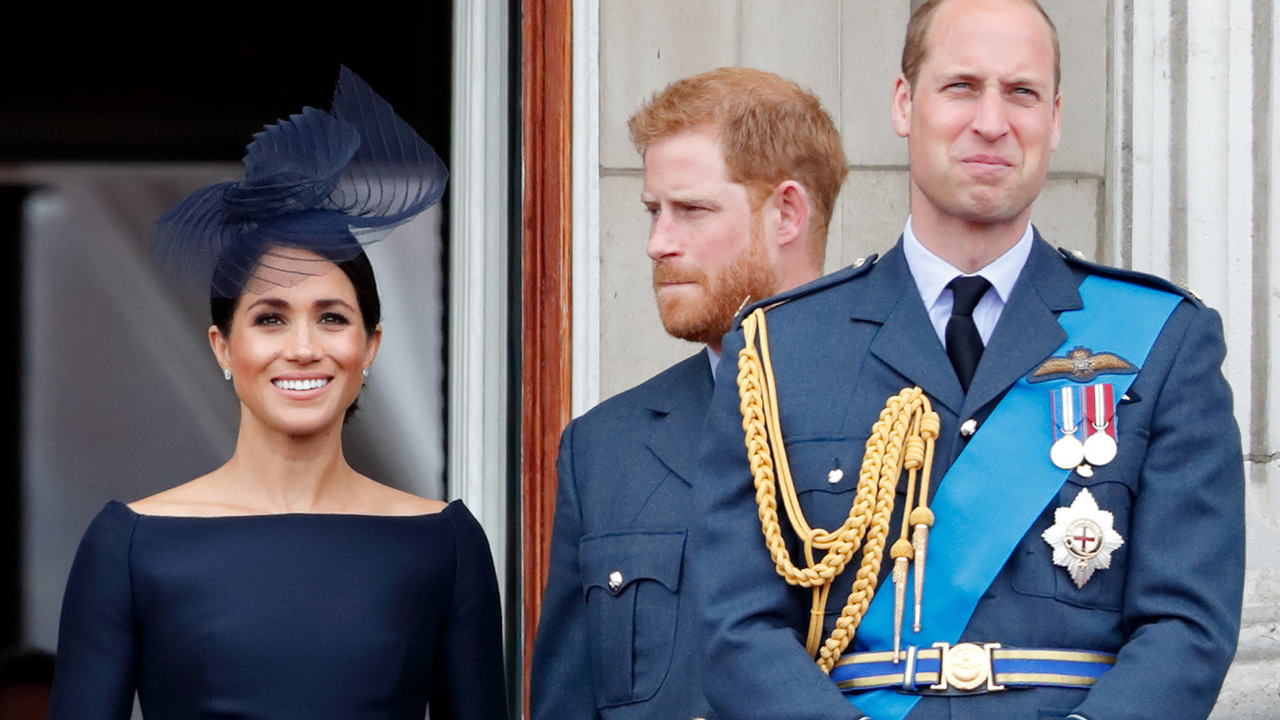 Meghan, Duchess of Sussex, Prince Harry, Duke of Sussex and Prince William, Duke of Cambridge watch a flypast to mark the centenary of the Royal Air Force from the balcony of Buckingham Palace on July 10, 2018 in London, England. The 100th birthday of the RAF, which was founded on on 1 April 1918, was marked with a centenary parade with the presentation of a new Queen&#039;s Colour and flypast of 100 aircraft over Buckingham Palace.