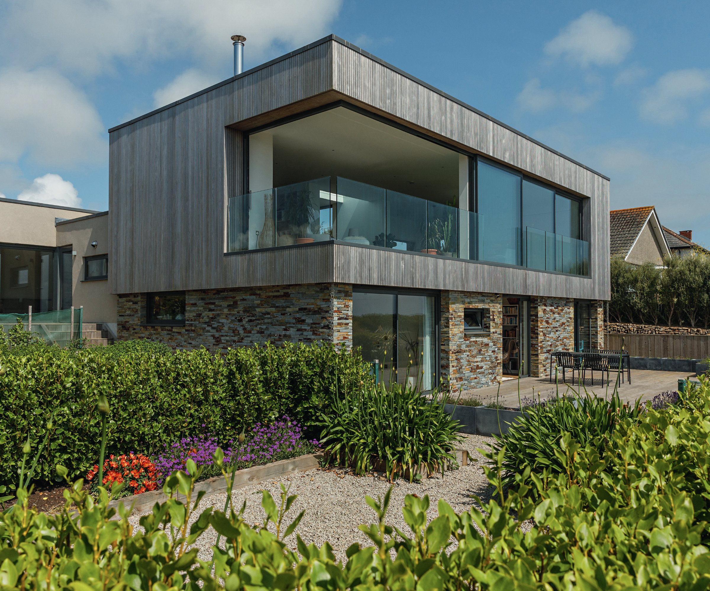 corner sliding doors on wooden clad extension