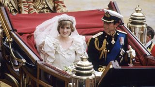 Prince Charles, Prince of Wales and Diana, Princess of Wales, wearing a wedding dress designed by David and Elizabeth Emanuel and the Spencer family Tiara, ride in an open carriage, from St. Paul's Cathedral to Buckingham Palace,