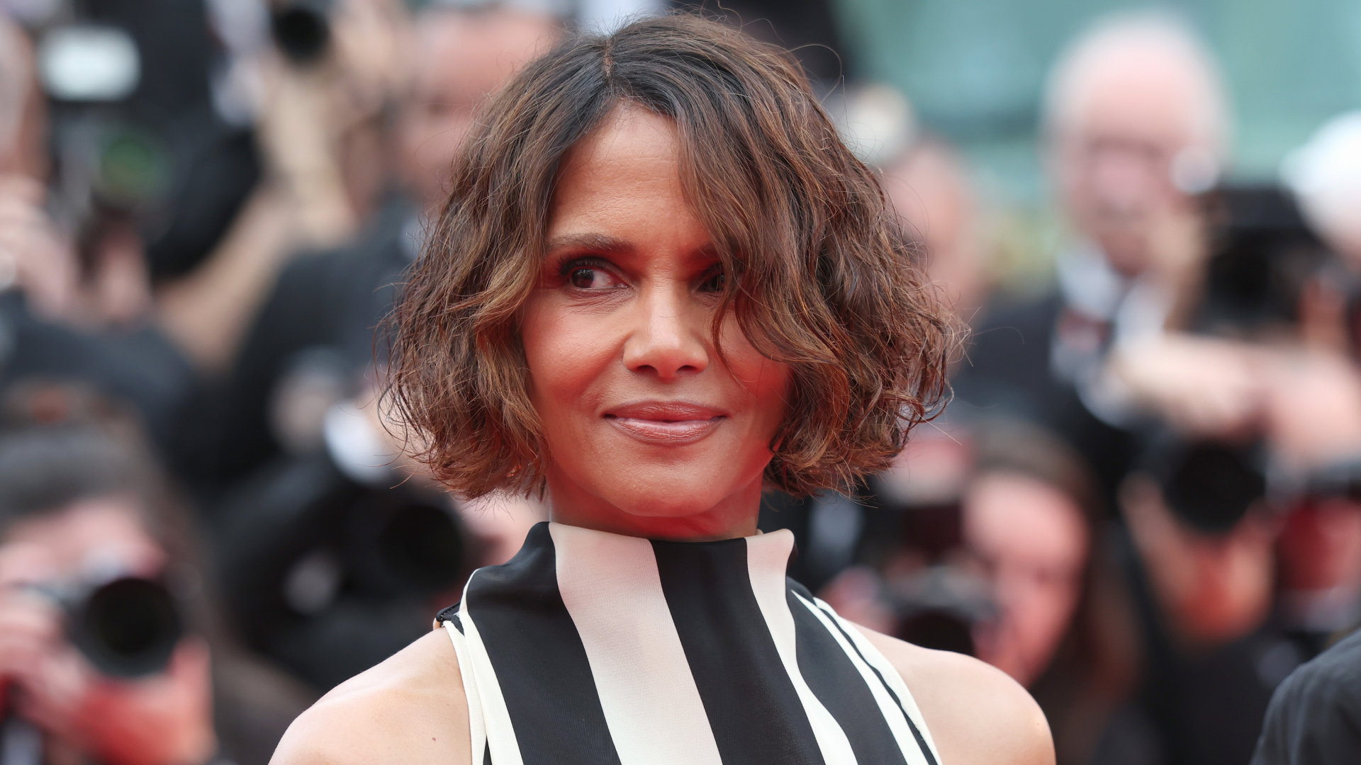 Halle Berry at the 2025 Cannes Film Festival wearing a striped Jacquemus dress