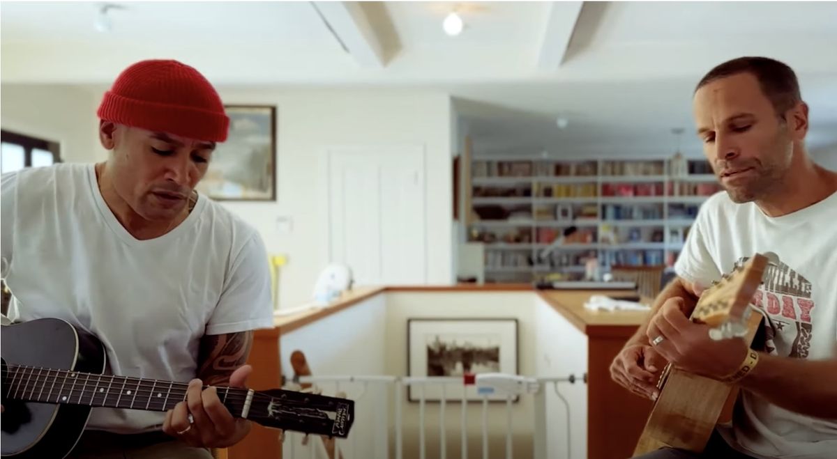 Ben Harper (left) and Jack Johnson perform the song Yard Sale together