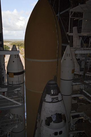 Only the nose of Space shuttle Atlantis is visible in this photo, with the top portions of the external fuel tank and two solid rocket boosters. The assembled vehicle sits atop a mobile launcher platform, awaiting its final journey from the Vehicle Assemb