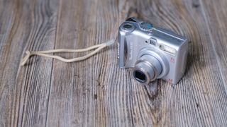 The Canon PowerShot A540 on a wood background
